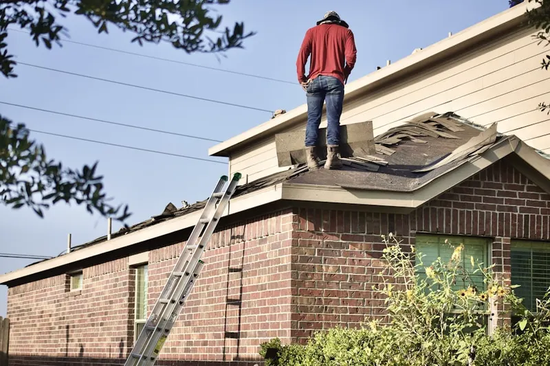 Professional roofer working on a residential roof in Downtown Huntington Beach